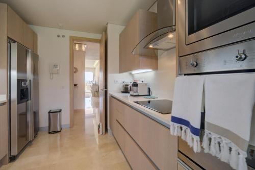 a kitchen with a sink and a counter top at Ribera del Marlin - Sotogrande in Sotogrande