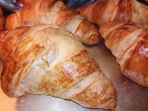 a group of croissants sitting on top of a table at Pension Behnisch in Strehla