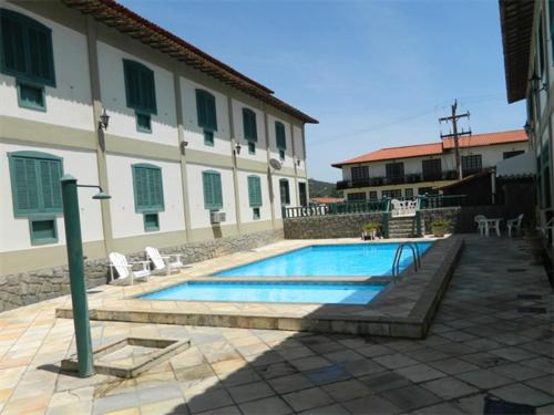 The swimming pool at or close to Cond. Hotel Âncora em frente Praia do Peró