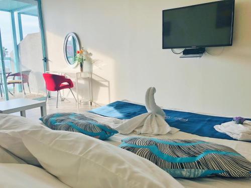 Katil atau katil-katil dalam bilik di Sur La Mer Hotel Ashdod
