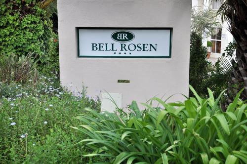 a sign for a bell rosen on the side of a building at Bell Rosen Guest House in Bellville