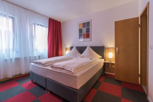 Postel nebo postele na pokoji v ubytování Hotel Luca