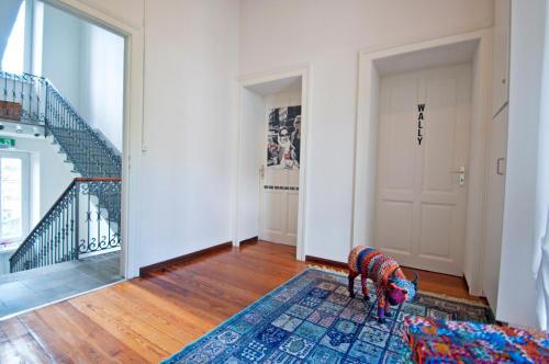 a living room with a couch and a rug at Villa Art'è in Locarno
