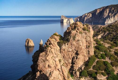 an island in the ocean with rocks in the water at Villa Laura in Nebida