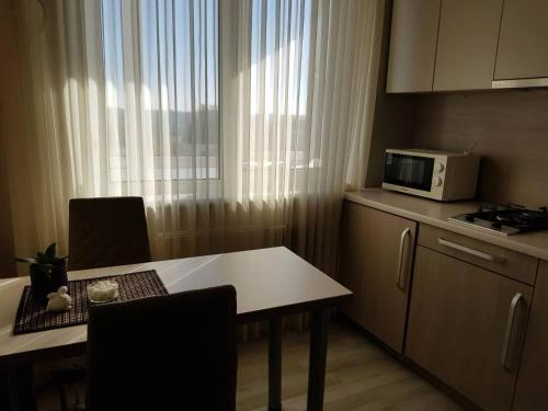 ครัวหรือมุมครัวของ Apartamentai Centras