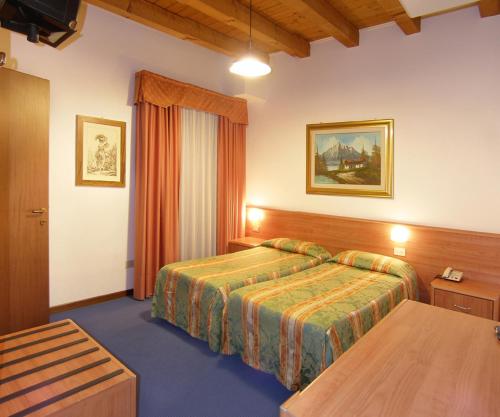 Postel nebo postele na pokoji v ubytování Hotel Da Bepi