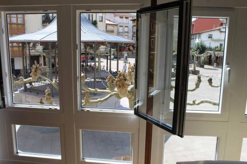 a window with a view of a street outside at Crisol Plaza in Ampuero