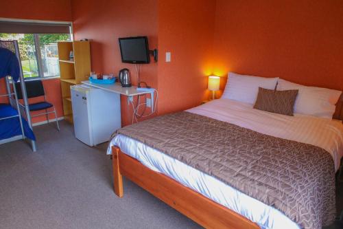 Кровать или кровати в номере Central City Camping Park