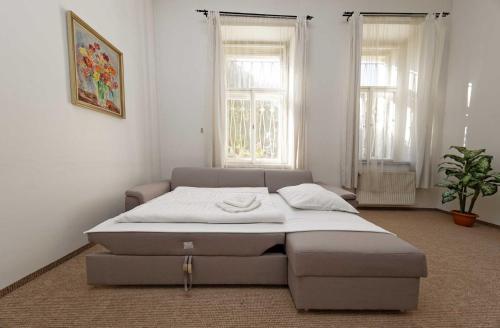 Postel nebo postele na pokoji v ubytování Apartments U Cisare