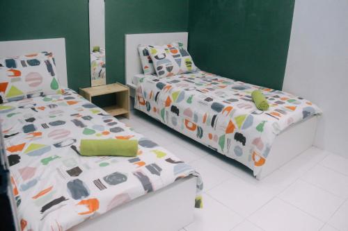Katil atau katil-katil dalam bilik di TheDaun Homestay Seri Iskandar, Perak