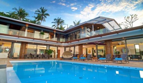 an exterior view of a house with a swimming pool at 9 Bedroom Sea Blue View Villa - 5 Star with Staff SDV080A-By Samui Dream Villas in Bophut