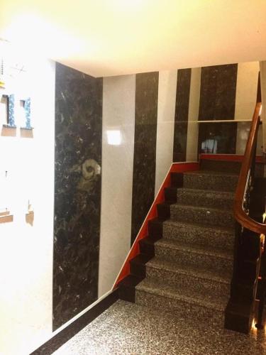 a staircase in a building with black and white stripes at Lo Fo Hotel in Taichung
