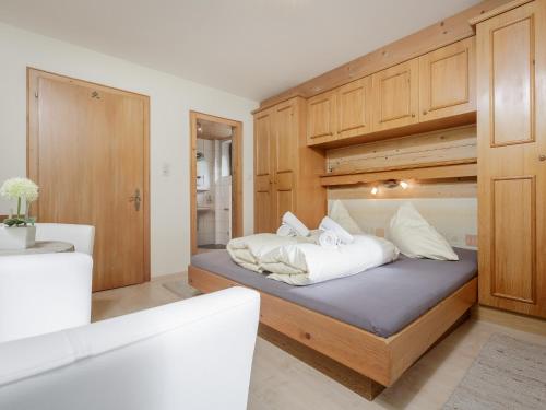 a bedroom with a bunk bed with white pillows at Apart Gentiana in Sölden