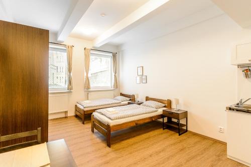 Posteľ alebo postele v izbe v ubytovaní Žižkov Cosy Studio Apartments