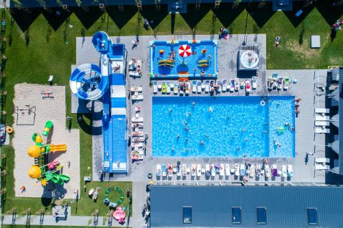 an overhead view of a water park with a pool at Holiday Park & Resort Rowy in Rowy
