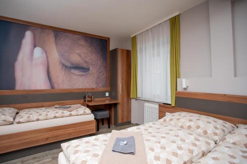 Postel nebo postele na pokoji v ubytování Hotel U koně
