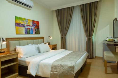 Ένα ή περισσότερα κρεβάτια σε δωμάτιο στο 360 Hotel By FHM