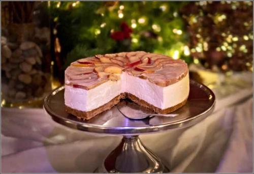 a piece of cake on a plate on a table at The Pytchley Inn in West Haddon