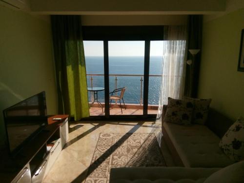 a living room with a view of the ocean at Apartment Sea Space 3 in Dobra Voda