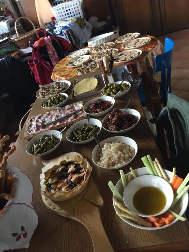 a table with many different types of food on it at Country House Salomè in Musile di Piave