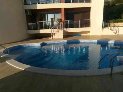 a swimming pool in the middle of a building at Apartment Sea Space 2 in Dobra Voda