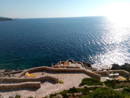 a view of the ocean from the top of a cliff at Apartment Sea Space in Dobra Voda