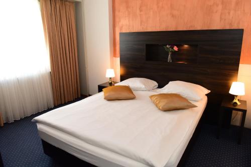 Ένα ή περισσότερα κρεβάτια σε δωμάτιο στο Hotel Töss
