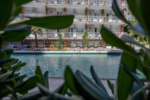 a swimming pool in front of a building at Angelina Residence in Maiori