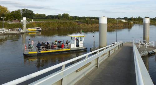 a group of people on a boat on a river at De Moeraseik in Zele