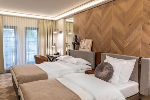 a hotel room with three beds and a desk at Hotel Traugutta3 in Białystok