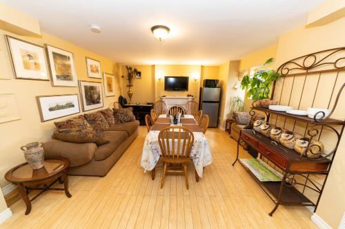 a living room with a couch and a table at Abba Inn Guest House in St. John's
