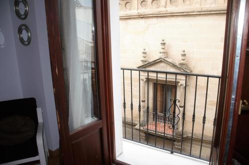a view of a building from a window at Apartamentos Turísticos Architettura Úbeda in Úbeda
