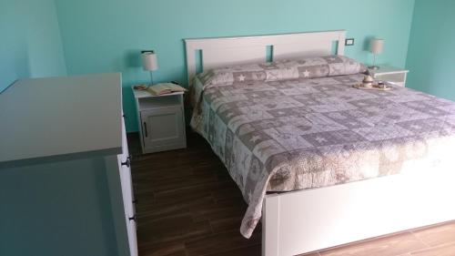 Ένα ή περισσότερα κρεβάτια σε δωμάτιο στο B&B Happy Guest