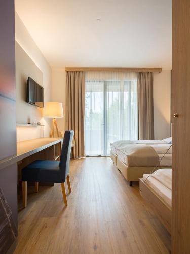 Hotel am See Rustにあるベッド
