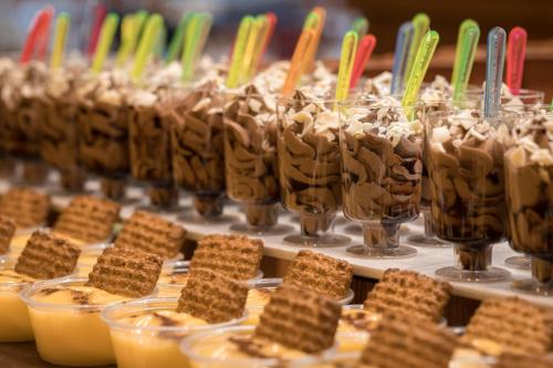 a display of desserts in glasses on a table at htop Pineda Palace 4Sup - Adults Recommended #htopBliss in Pineda de Mar