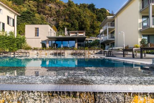 a swimming pool in the middle of a building at Hotel Domaso in Domaso