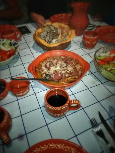 a table with a bowl of food and a cup of coffee at Casa Celeste in Castro Daire