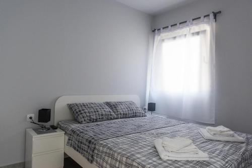 Una cama o camas en una habitación de " Tiamat " apartmani