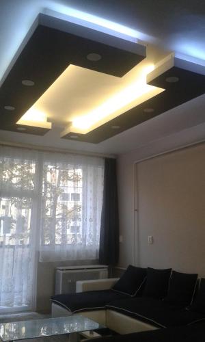 a living room with a couch and a window at Home in Zalaegerszeg