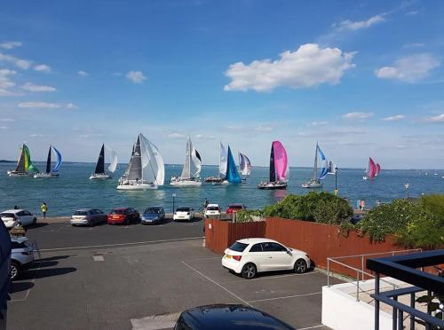 a bunch of sail boats in the water at BEST WESTERN New Holmwood Hotel in Cowes