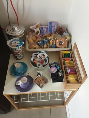a shelf with food and other items on it at Casa di Giulia in Verona