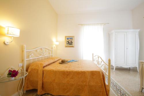 Postel nebo postele na pokoji v ubytování B&B Monsignore