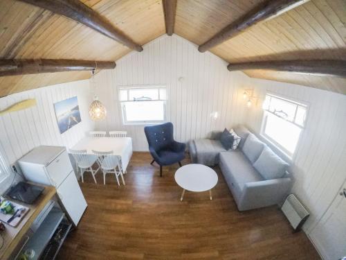 a living room with a couch and a table at Norwegian Wild in Vangsvik