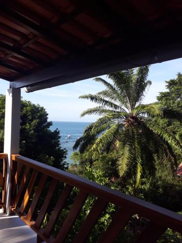 a balcony with a view of the ocean at Pousada Residence Vila das Flores in Morro de São Paulo