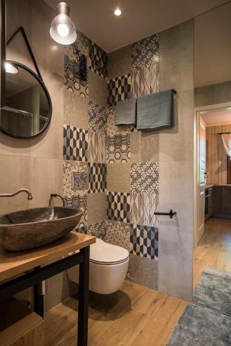 a bathroom with a sink and a toilet at SKRZAT in Tumlin