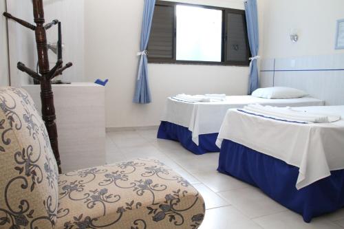 Ένα ή περισσότερα κρεβάτια σε δωμάτιο στο Hotel Lago Azul