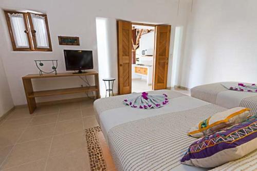Ένα ή περισσότερα κρεβάτια σε δωμάτιο στο Villas Naomi