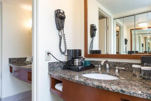 a bathroom with a sink and a phone at Evergreen Lodge at Vail in Vail