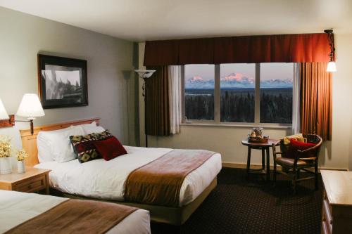Ένα ή περισσότερα κρεβάτια σε δωμάτιο στο Talkeetna Alaskan Lodge