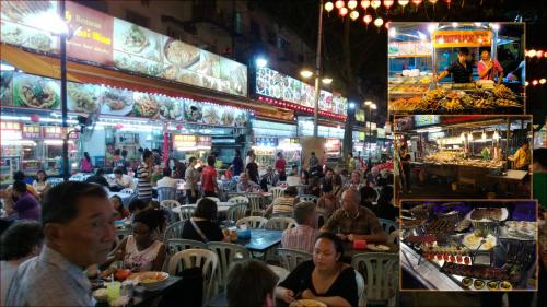 a group of people sitting at a restaurant at night at CITI HOTEL @ KL SENTRAL in Kuala Lumpur